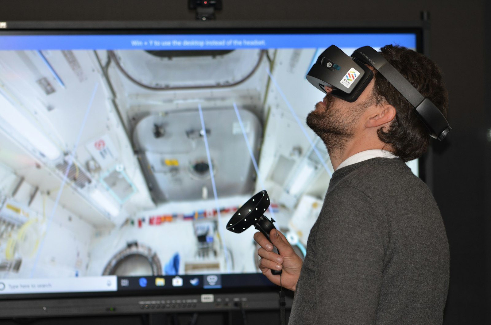 Operator wearing a VR headset during a tactical simulation session